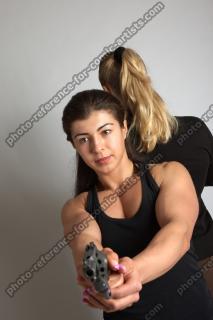 OXANA AND XENIA STANDING POSE WITH GUNS 3 (5)